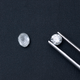 Uncut diamond (left) next to a cut, polished diamond (right), both created in a lab, as seen at the Ada Diamonds showroom in Manhattan.